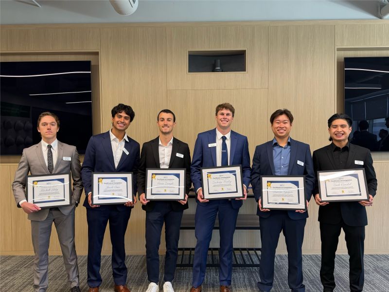 Lennar interns holding framed certificates after the summer program.